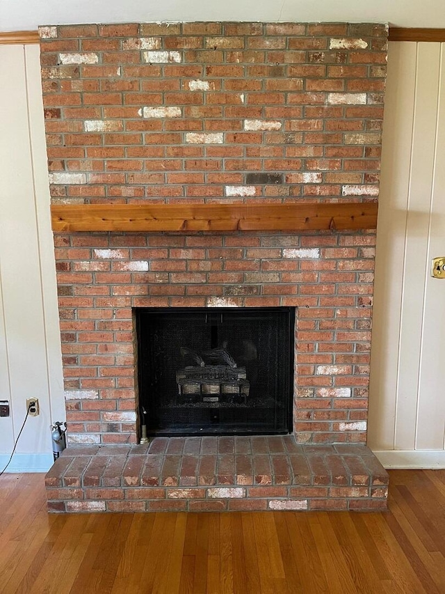 3210 Orchard Hill Rd SW, Roanoke, VA 24018 - detailed view of a brick fireplace and wood finished floors