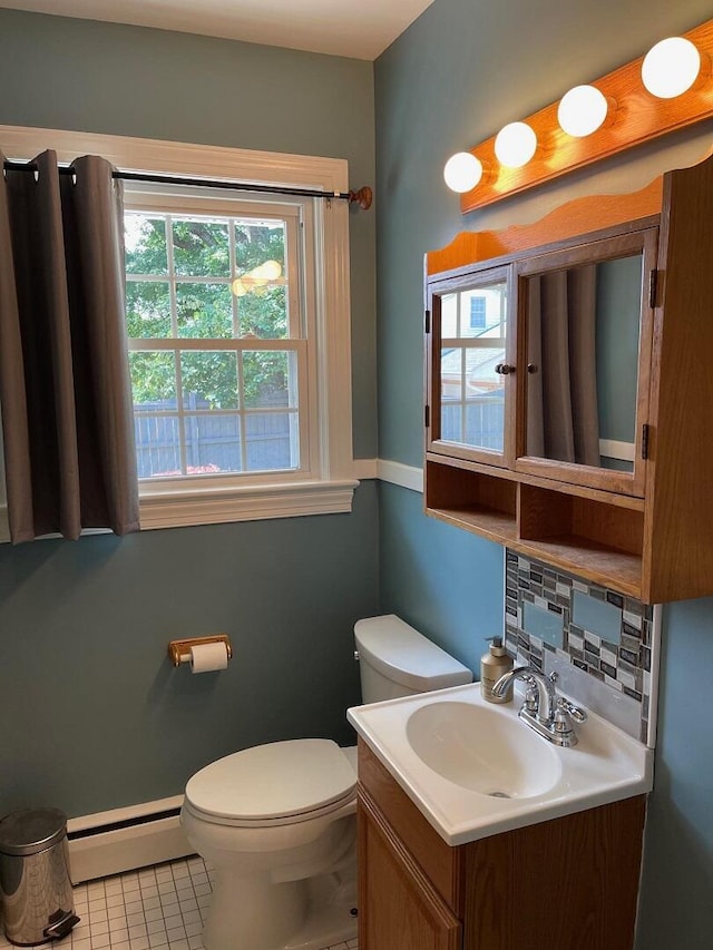 3210 Orchard Hill Rd SW, Roanoke, VA 24018 - half bathroom featuring a baseboard heating unit, vanity, and tile patterned flooring