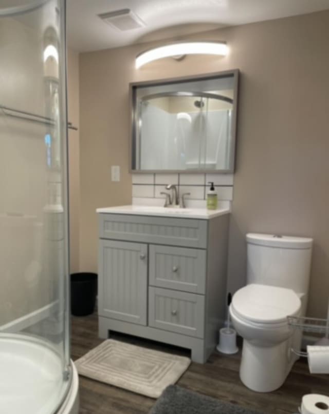 3210 Orchard Hill Rd SW, Roanoke, VA 24018 - full bath with wood finished floors, a stall shower, and vanity