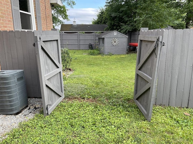 3210 Orchard Hill Rd SW, Roanoke, VA 24018 - fenced backyard featuring a storage unit and a gate