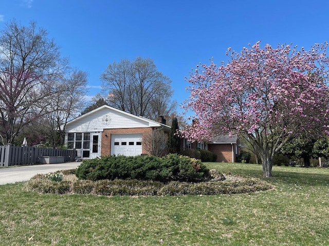 3210 Orchard Hill Rd SW, Roanoke, VA 24018 - view of home's exterior with brick siding, a garage, and driveway