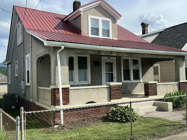 115 E Walnut St, Covington, VA 24426 - bungalow-style home featuring covered porch, stucco siding, and a standing seam roof