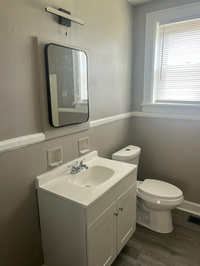 115 E Walnut St, Covington, VA 24426 - half bath featuring vanity and wood finished floors