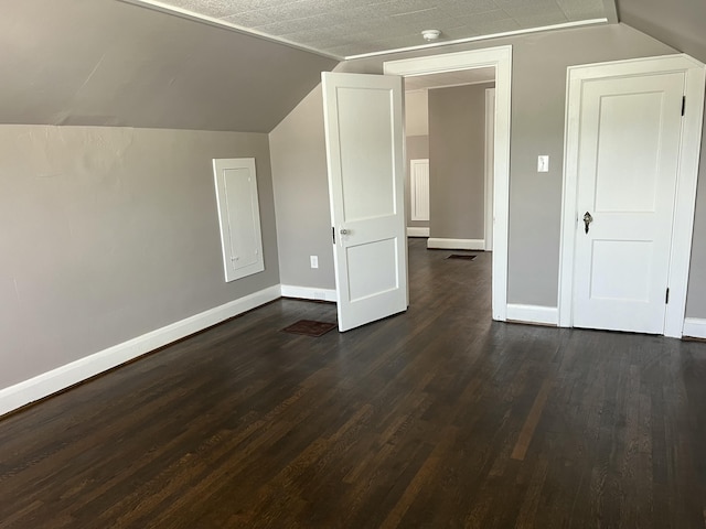 115 E Walnut St, Covington, VA 24426 - additional living space with dark wood-type flooring and vaulted ceiling