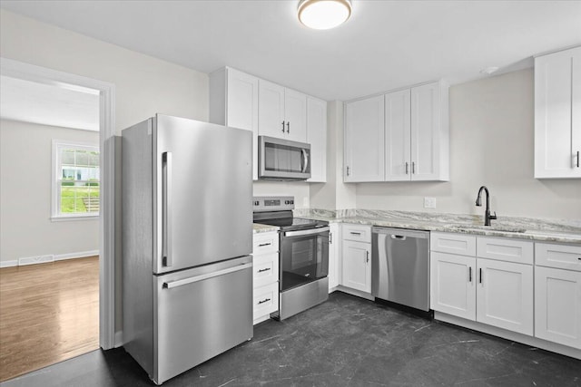 21 Upland Dr, Salem, VA 24153 - kitchen with stainless steel appliances, white cabinets, and light stone counters