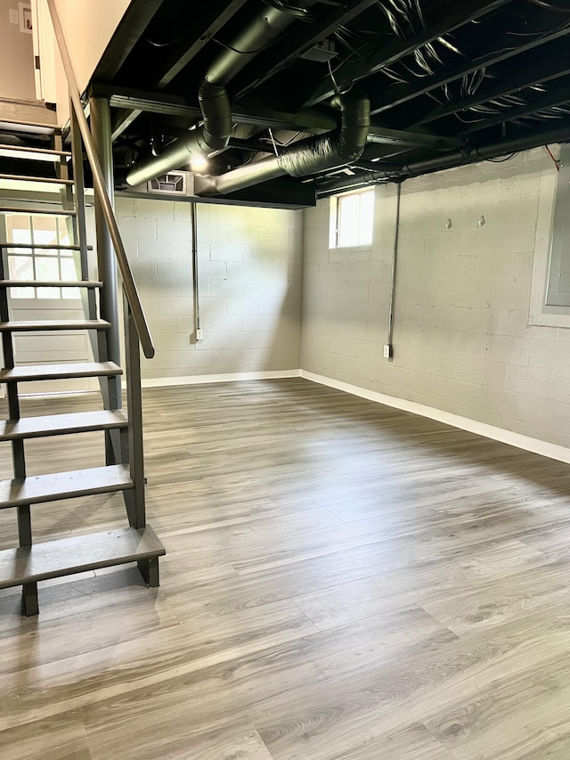 21 Upland Dr, Salem, VA 24153 - below grade area with wood finished floors, stairs, and electric panel
