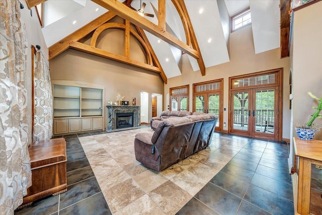 223 Moonriver Ln, Moneta, VA 24121 - living room with high vaulted ceiling, french doors, a high end fireplace, and recessed lighting