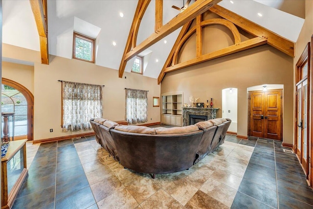 223 Moonriver Ln, Moneta, VA 24121 - living area featuring high vaulted ceiling, arched walkways, a fireplace, healthy amount of natural light, and recessed lighting