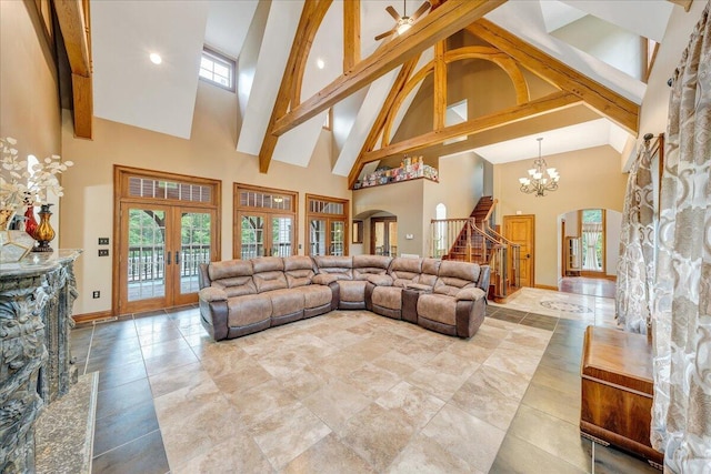 223 Moonriver Ln, Moneta, VA 24121 - living area featuring high vaulted ceiling, arched walkways, stairway, french doors, and beamed ceiling
