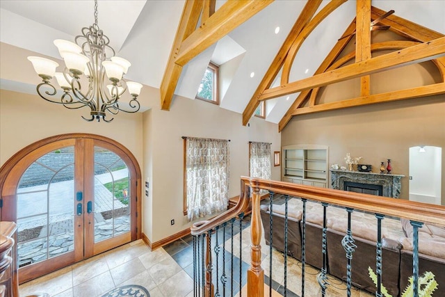 223 Moonriver Ln, Moneta, VA 24121 - tiled foyer entrance with high vaulted ceiling, french doors, a chandelier, beamed ceiling, and a fireplace