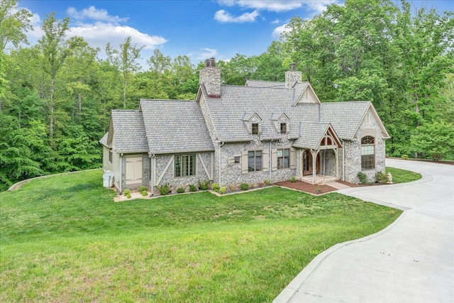 223 Moonriver Ln, Moneta, VA 24121 - english style home featuring stone siding, a chimney, and a front lawn