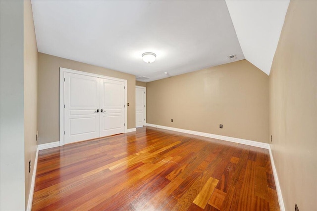 223 Moonriver Ln, Moneta, VA 24121 - unfurnished bedroom with wood finished floors, a closet, and lofted ceiling