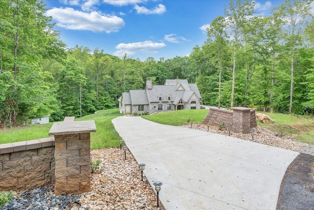 223 Moonriver Ln, Moneta, VA 24121 - view of front of house with a forest view and a front yard