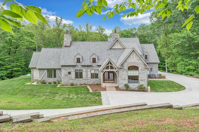 223 Moonriver Ln, Moneta, VA 24121 - view of front of property featuring stone siding, a chimney, and a front yard
