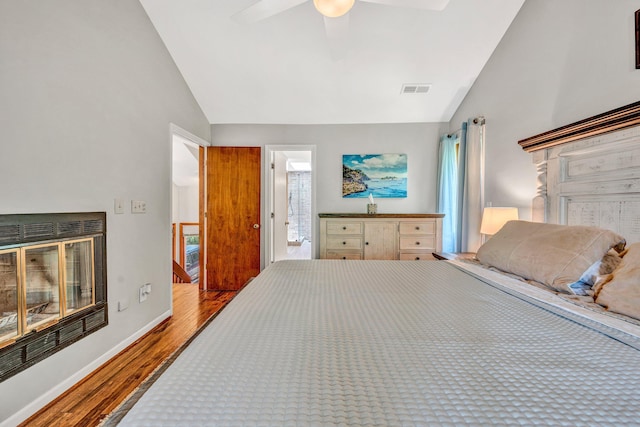7102 Crown Rd, Roanoke, VA 24018 - bedroom with vaulted ceiling, wood finished floors, multiple windows, and ceiling fan