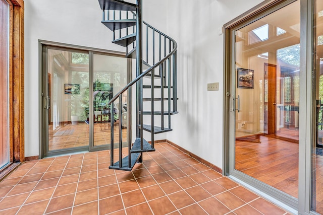 7102 Crown Rd, Roanoke, VA 24018 - foyer with a towering ceiling, tile patterned floors, and stairway