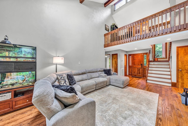 7102 Crown Rd, Roanoke, VA 24018 - living room featuring a high ceiling, stairway, wood-type flooring, beamed ceiling, and recessed lighting