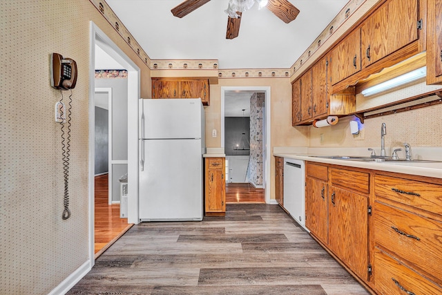 5428 Sweetfern Dr, Roanoke, VA 24019 - kitchen featuring white appliances, ceiling fan, wood finished floors, brown cabinetry, and wallpapered walls
