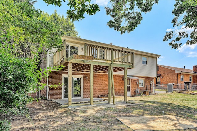 5428 Sweetfern Dr, Roanoke, VA 24019 - back of property with a gate, brick siding, and a patio