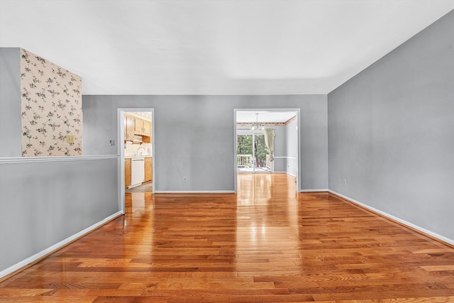 5428 Sweetfern Dr, Roanoke, VA 24019 - unfurnished room featuring wood finished floors and a chandelier