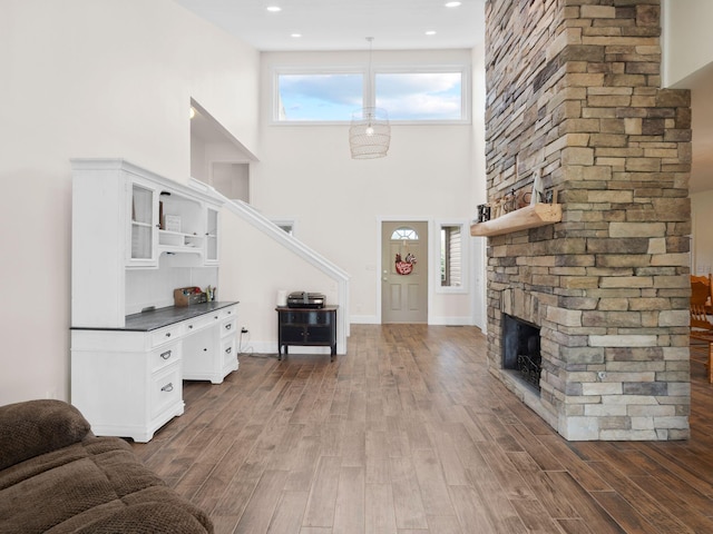 6000 Ferrum Mountain Rd, Callaway, VA 24067 - living area featuring dark wood-style flooring, a fireplace, a high ceiling, and recessed lighting