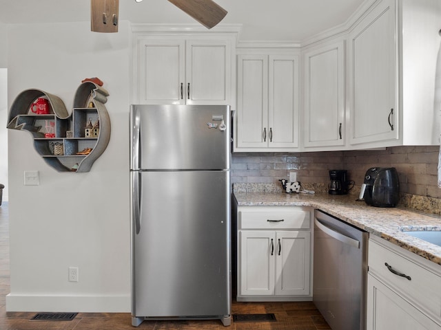 6000 Ferrum Mountain Rd, Callaway, VA 24067 - kitchen featuring appliances with stainless steel finishes, tasteful backsplash, white cabinetry, and light stone countertops