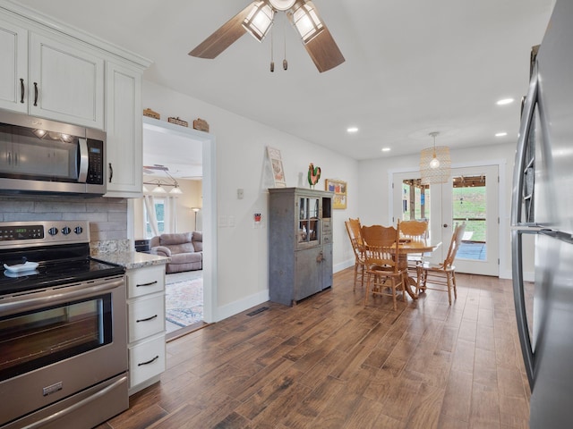 6000 Ferrum Mountain Rd, Callaway, VA 24067 - kitchen with stainless steel appliances, white cabinetry, dark wood-style floors, plenty of natural light, and recessed lighting