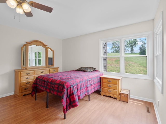 6000 Ferrum Mountain Rd, Callaway, VA 24067 - bedroom with light wood-style flooring and a ceiling fan
