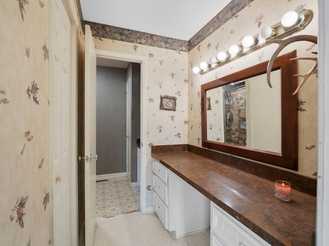 6000 Ferrum Mountain Rd, Callaway, VA 24067 - bathroom featuring wallpapered walls, vanity, and tile patterned floors