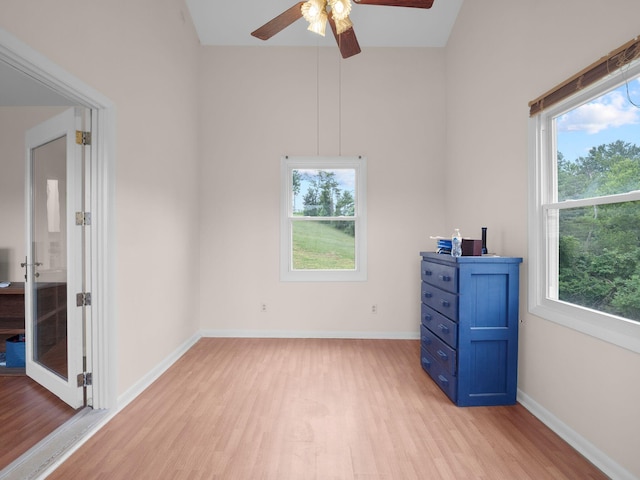 6000 Ferrum Mountain Rd, Callaway, VA 24067 - unfurnished bedroom featuring light wood-style flooring, multiple windows, and ceiling fan