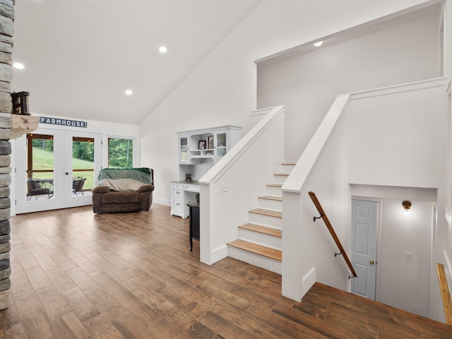 6000 Ferrum Mountain Rd, Callaway, VA 24067 - stairs with high vaulted ceiling, french doors, wood finished floors, and recessed lighting
