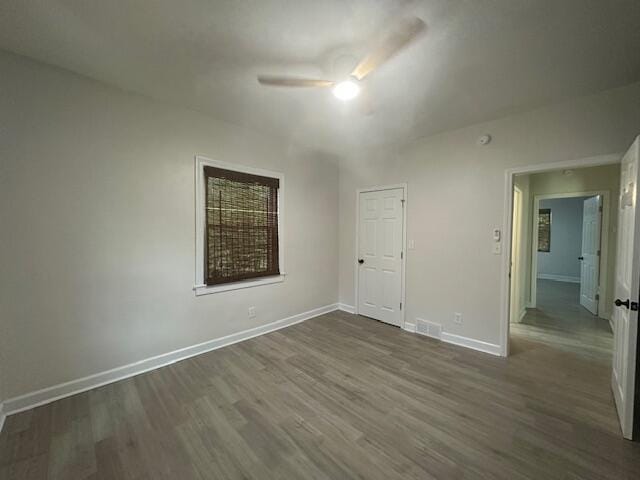 2327 Horsepasture Price Rd, Ridgeway, VA 24148 - unfurnished room featuring a ceiling fan and dark wood-style flooring