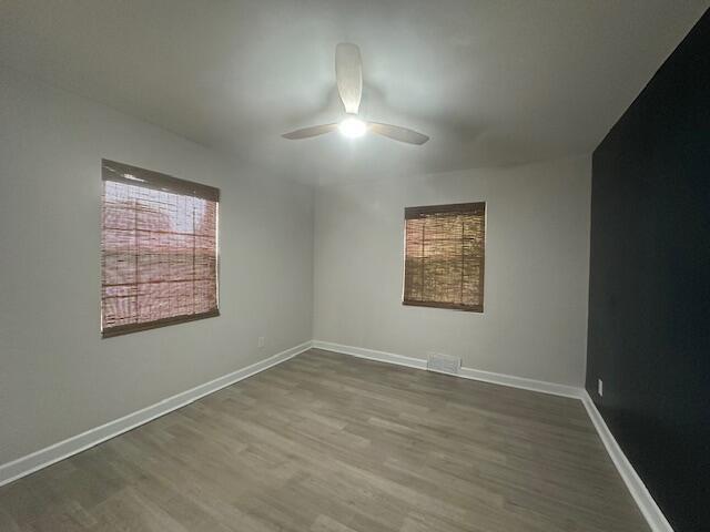 2327 Horsepasture Price Rd, Ridgeway, VA 24148 - empty room with ceiling fan and wood finished floors