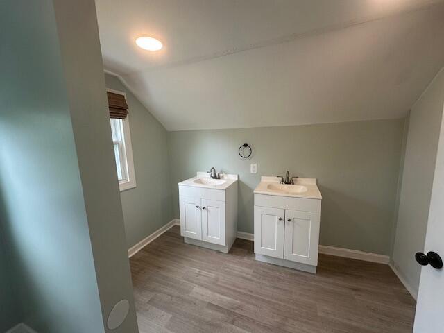 2327 Horsepasture Price Rd, Ridgeway, VA 24148 - bathroom featuring vanity, wood finished floors, and lofted ceiling
