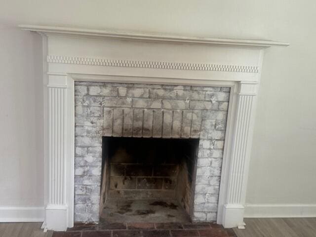2327 Horsepasture Price Rd, Ridgeway, VA 24148 - detailed view of a brick fireplace and wood finished floors