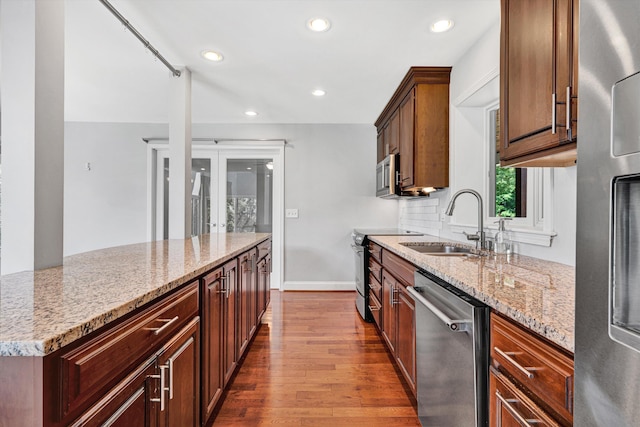 571 Cary Rd, Pilot, VA 24138 - kitchen with appliances with stainless steel finishes, light stone counters, dark wood finished floors, recessed lighting, and french doors