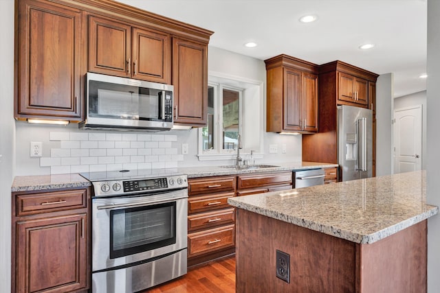 571 Cary Rd, Pilot, VA 24138 - kitchen with stainless steel appliances, dark wood-style floors, light stone countertops, recessed lighting, and a center island