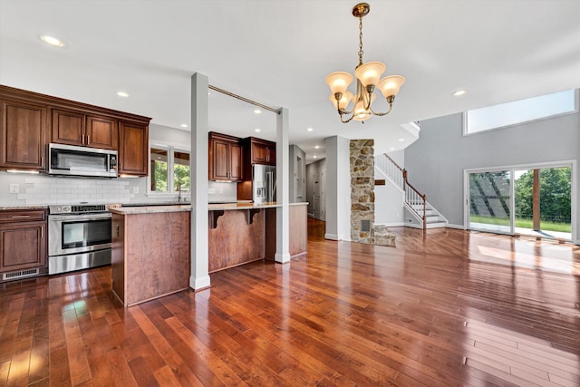 571 Cary Rd, Pilot, VA 24138 - kitchen with stainless steel appliances, dark wood-style floors, a chandelier, open floor plan, and pendant lighting