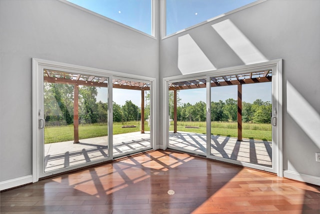 571 Cary Rd, Pilot, VA 24138 - unfurnished sunroom featuring view of wooded area