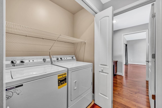 571 Cary Rd, Pilot, VA 24138 - washroom featuring washer and clothes dryer and wood finished floors