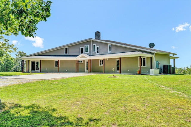 571 Cary Rd, Pilot, VA 24138 - view of front of house featuring driveway, a chimney, and a front yard