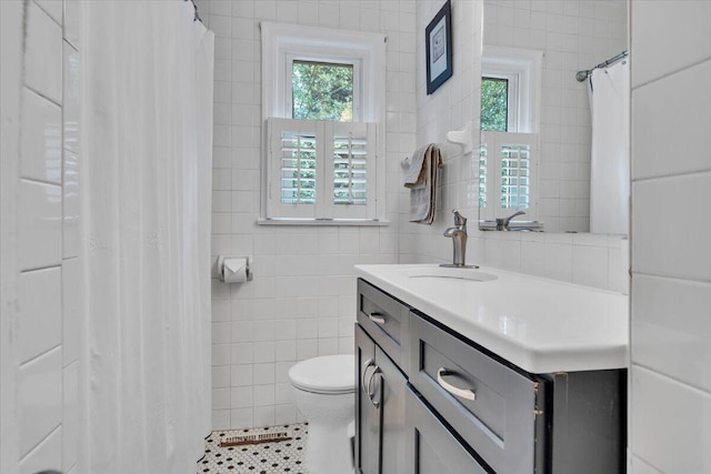 2728 Lansing Dr SW, Roanoke, VA 24015 - bathroom featuring tile walls, plenty of natural light, vanity, tile patterned floors, and a shower with curtain