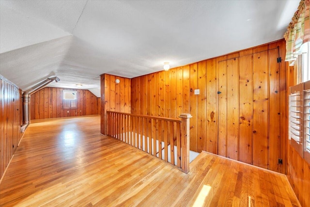 2728 Lansing Dr SW, Roanoke, VA 24015 - bonus room with wood finished floors, wooden walls, and vaulted ceiling
