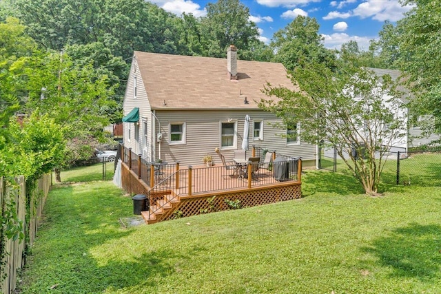 2728 Lansing Dr SW, Roanoke, VA 24015 - back of property with a fenced backyard, a chimney, a deck, and a shingled roof