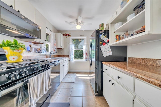 2728 Lansing Dr SW, Roanoke, VA 24015 - kitchen featuring stainless steel appliances, a ceiling fan, white cabinets, light countertops, and light tile patterned floors