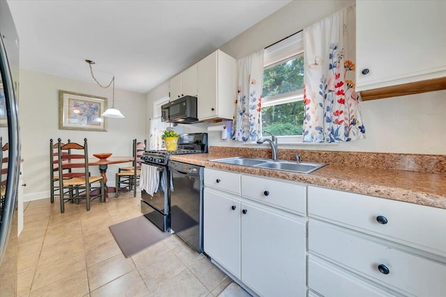 2728 Lansing Dr SW, Roanoke, VA 24015 - kitchen with black appliances, white cabinets, decorative light fixtures, and light countertops