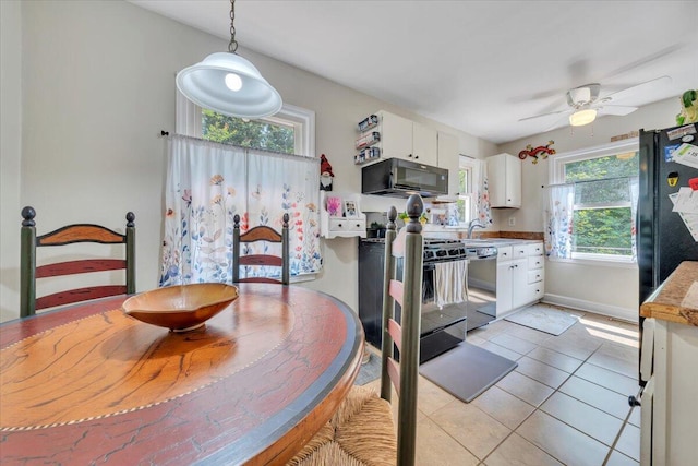 2728 Lansing Dr SW, Roanoke, VA 24015 - dining area with light tile patterned floors and a ceiling fan