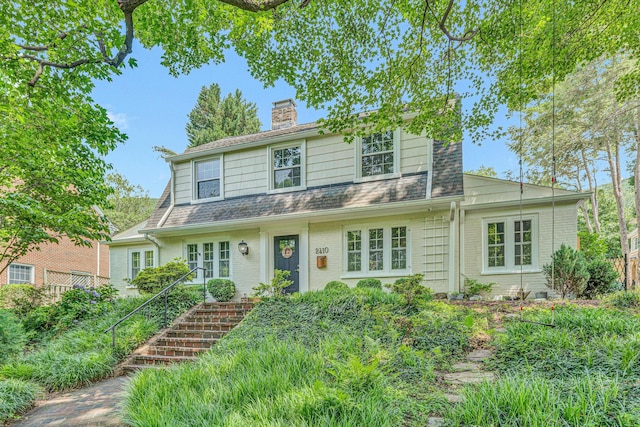 2410 Cornwallis Ave SE, Roanoke, VA 24014 - view of front facade with a chimney, brick siding, and stairway