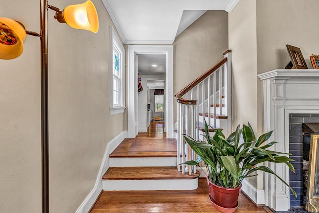 2410 Cornwallis Ave SE, Roanoke, VA 24014 - stairway featuring a fireplace and wood finished floors