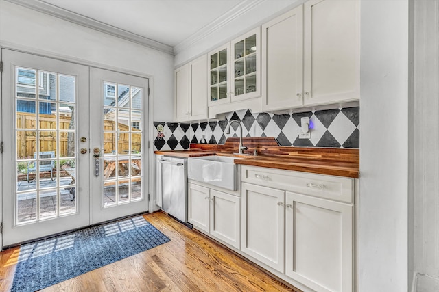 2410 Cornwallis Ave SE, Roanoke, VA 24014 - kitchen featuring stainless steel dishwasher, wood counters, crown molding, decorative backsplash, and white cabinets